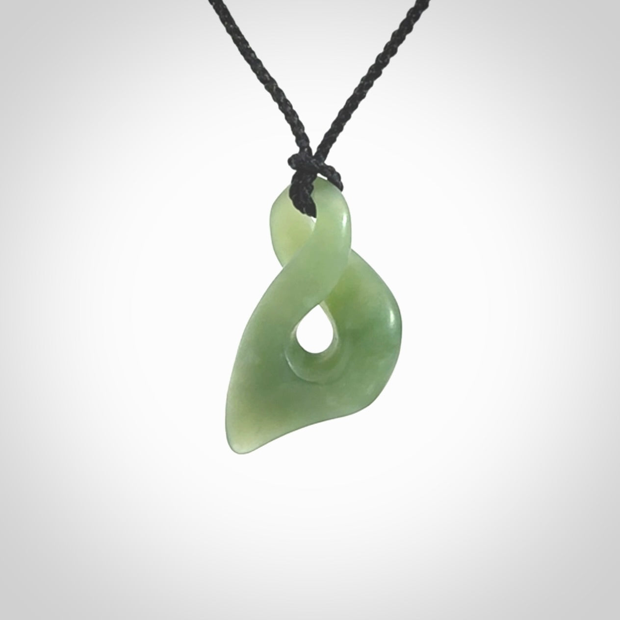 Hand carved small sized, New Zealand Inanga jade twist pendant.
