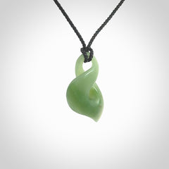 Hand carved small sized, New Zealand Inanga jade twist pendant.