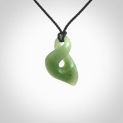 Hand carved small sized, New Zealand Inanga jade twist pendant.