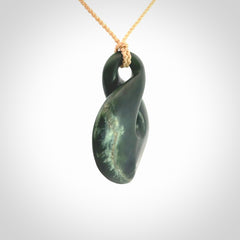 This piece is a drop shaped, single twist pendant. It was carved for us by Ric Moor from a lovely deep green piece of New Zealand jade. It is suspended on an beige four plaited braided cord that is length adjustable.