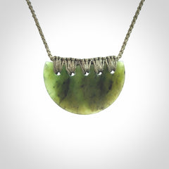 Hand carved pounamu small shield drop pendant. Jade necklace hand made in New Zealand. A contemporary drop pendant carved from rare New Zealand jade.