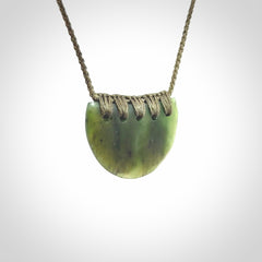 Hand carved pounamu small shield drop pendant. Jade necklace hand made in New Zealand. A contemporary drop pendant carved from rare New Zealand jade.