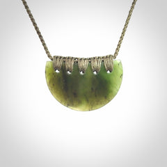 Hand carved pounamu small shield drop pendant. Jade necklace hand made in New Zealand. A contemporary drop pendant carved from rare New Zealand jade.