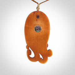This is a hand carved bone contemporary female pendant. Yuri Terenyi has carved this from Stained Bone with Woolly Mammoth Tusk and Paua Shell inlay on the back of the pendant. It is a delightful, large and artistic piece of jewellery. One only necklace. The necklace is provided on an adjustable cord in a hand made, custom, wooden box.