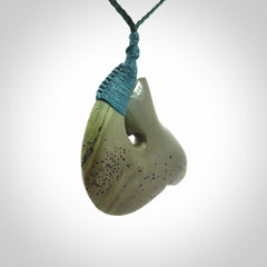 Hand carved New Zealand Kokopu jade hook, matau pendant.