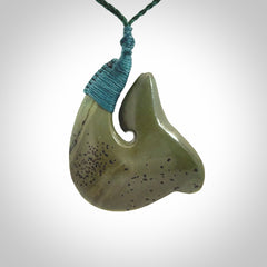 Hand carved New Zealand Kokopu jade hook, matau pendant.
