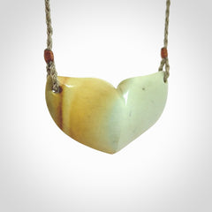 Hand carved New Zealand Flower Jade whale tail pendant.
