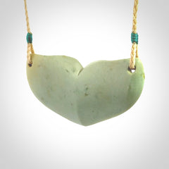 Hand carved New Zealand Flower Jade whale tail pendant.