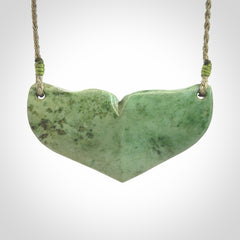 Hand carved New Zealand Jade whale tail pendant.
