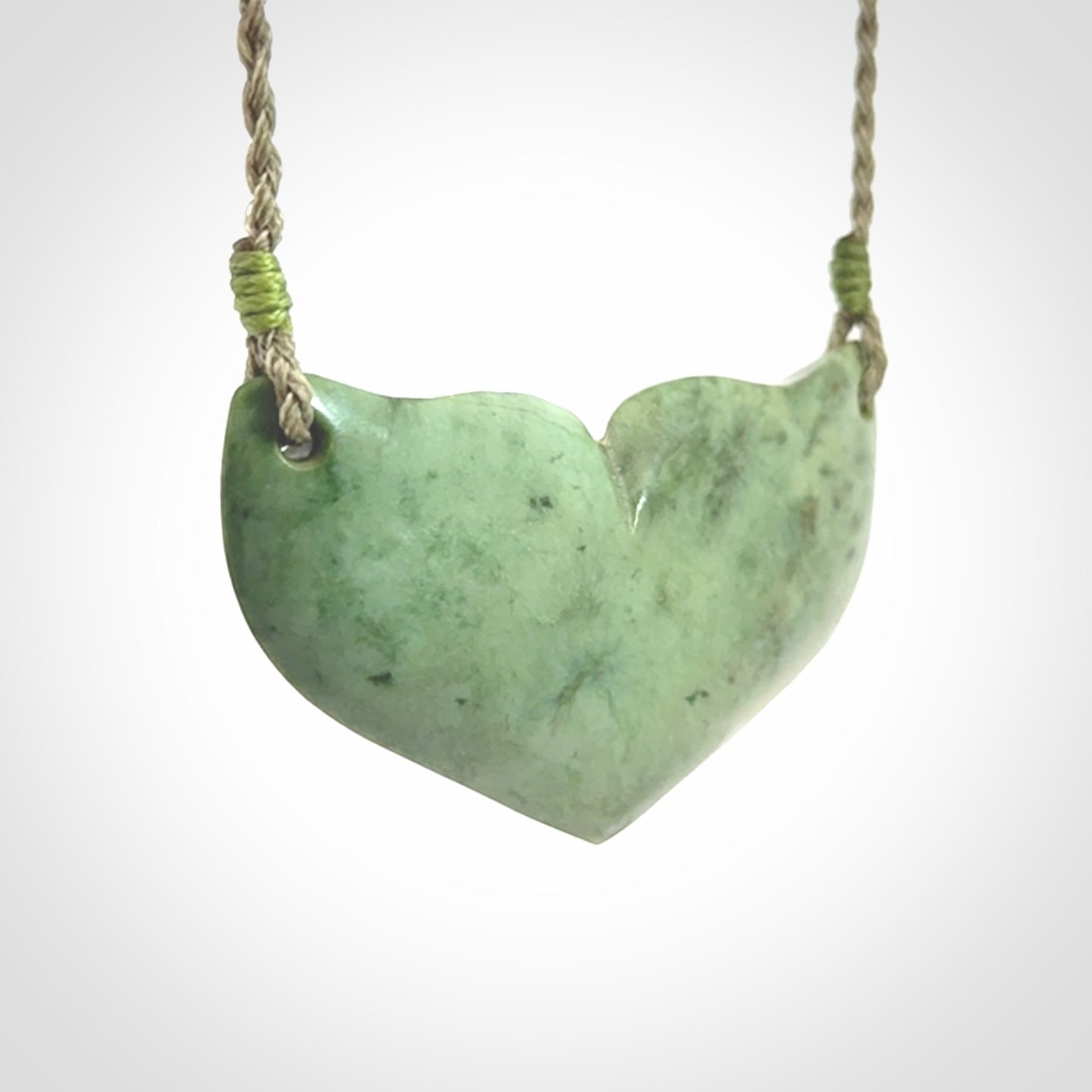 Hand carved New Zealand Jade whale tail pendant.