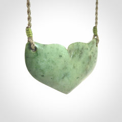 Hand carved New Zealand Jade whale tail pendant.
