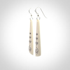 Hand carved large bone earrings with dreamcatcher engraving.