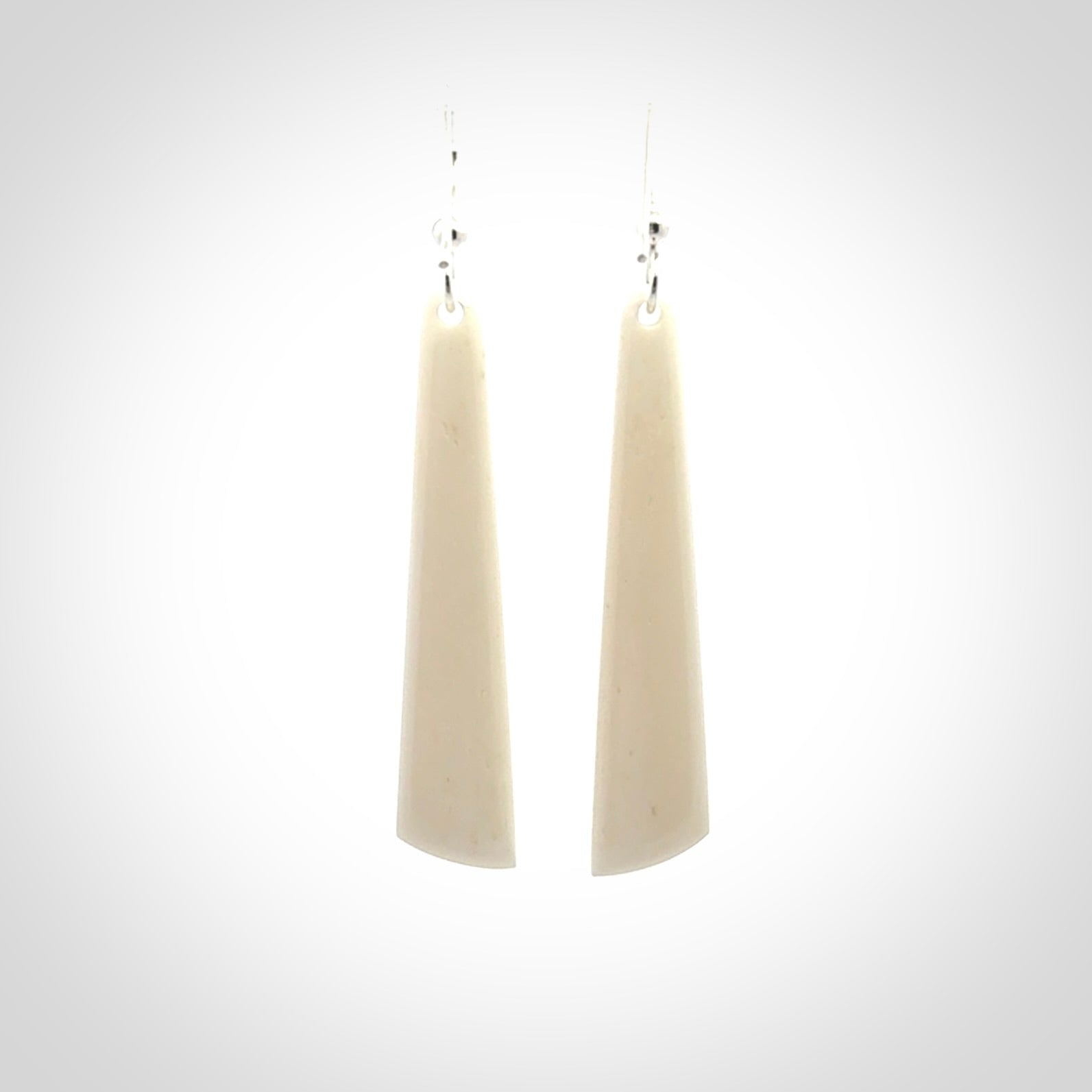 Hand carved large bone earrings with dreamcatcher engraving.