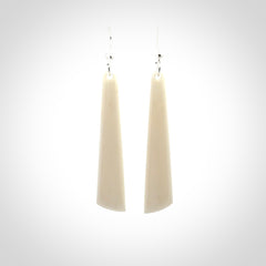 Hand carved large bone earrings with dreamcatcher engraving.