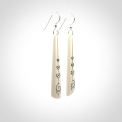 Hand carved large bone earrings with dreamcatcher engraving.