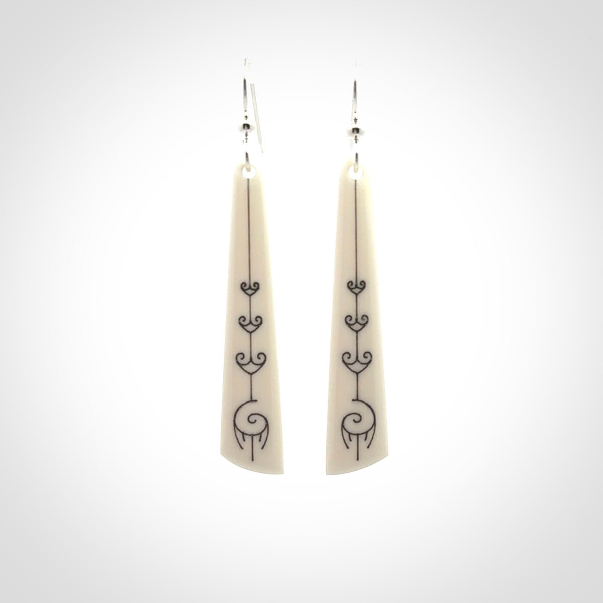 Hand carved large bone earrings with dreamcatcher engraving.
