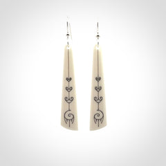 Hand carved large bone earrings with dreamcatcher engraving.