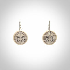 Hand carved round bone koru earrings with double sided engraving.