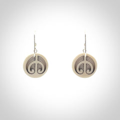 Hand carved round bone koru earrings with double sided engraving.