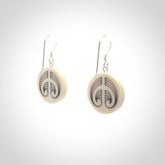 Hand carved round bone koru earrings with double sided engraving.