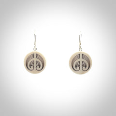 Hand carved round bone koru earrings with double sided engraving.