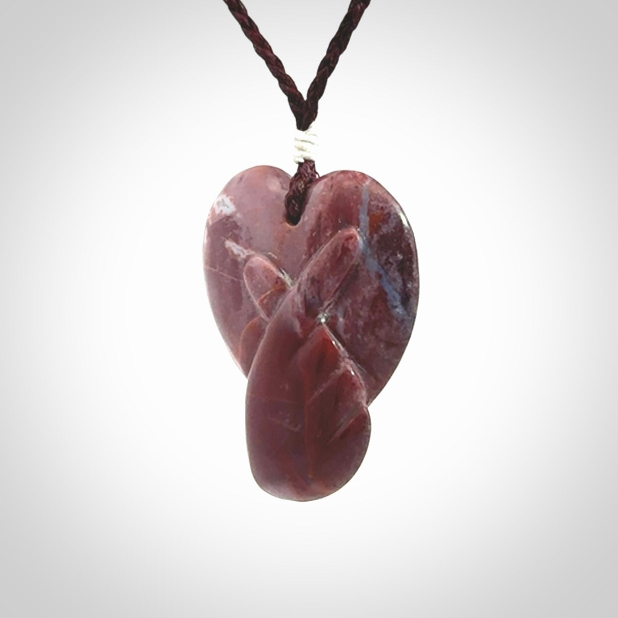 This is a hand carved love heart pendant made from a gorgeous and striking piece of Brecciated jasper stone. This is a superbly carved and very unique piece. For sale online from NZ Pacific.