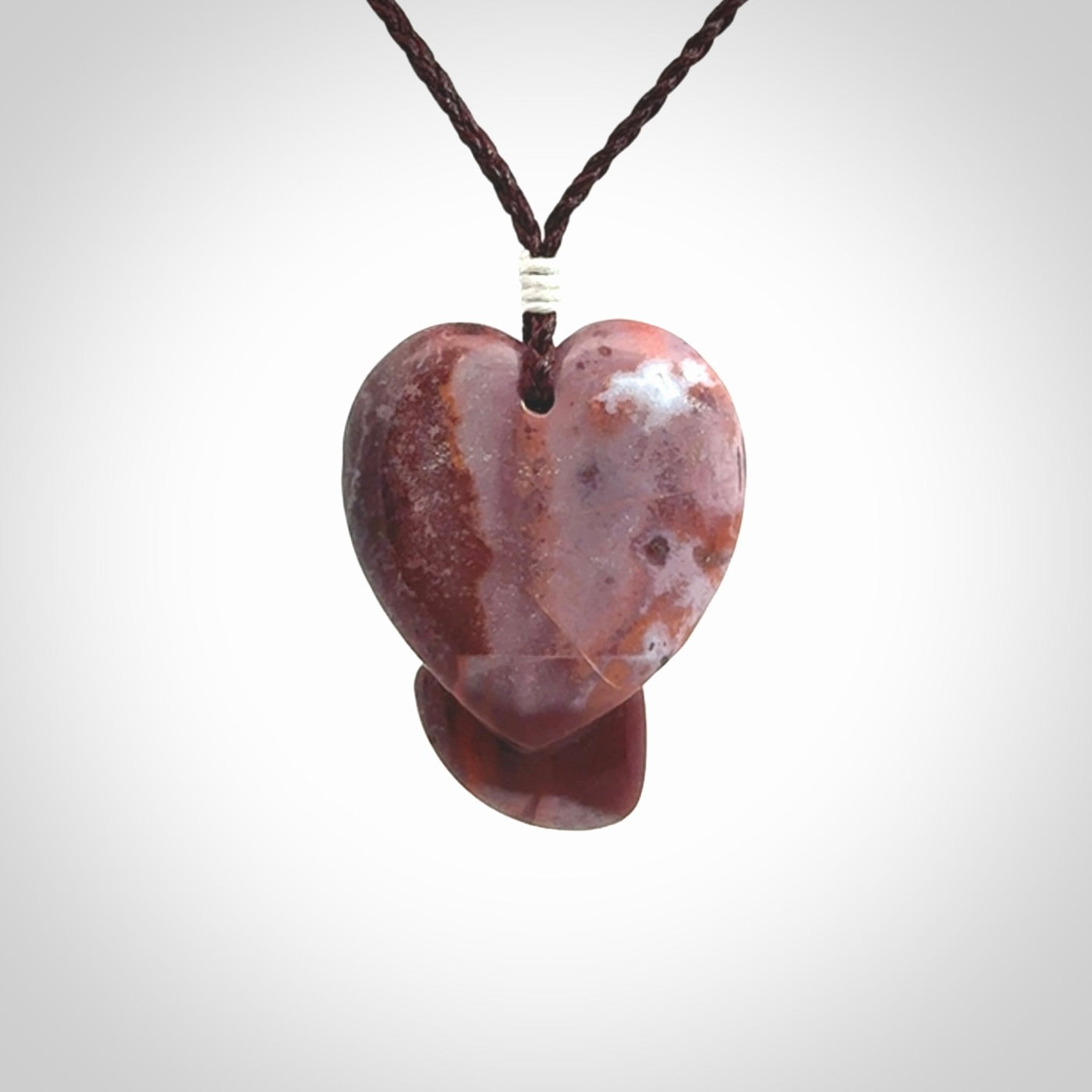 This is a hand carved love heart pendant made from a gorgeous and striking piece of Brecciated jasper stone. This is a superbly carved and very unique piece. For sale online from NZ Pacific.