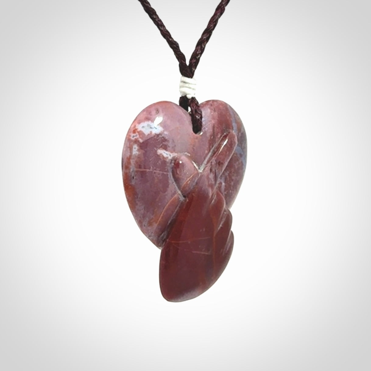 This is a hand carved love heart pendant made from a gorgeous and striking piece of Brecciated jasper stone. This is a superbly carved and very unique piece. For sale online from NZ Pacific.