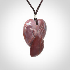 This is a hand carved love heart pendant made from a gorgeous and striking piece of Brecciated jasper stone. This is a superbly carved and very unique piece. For sale online from NZ Pacific.
