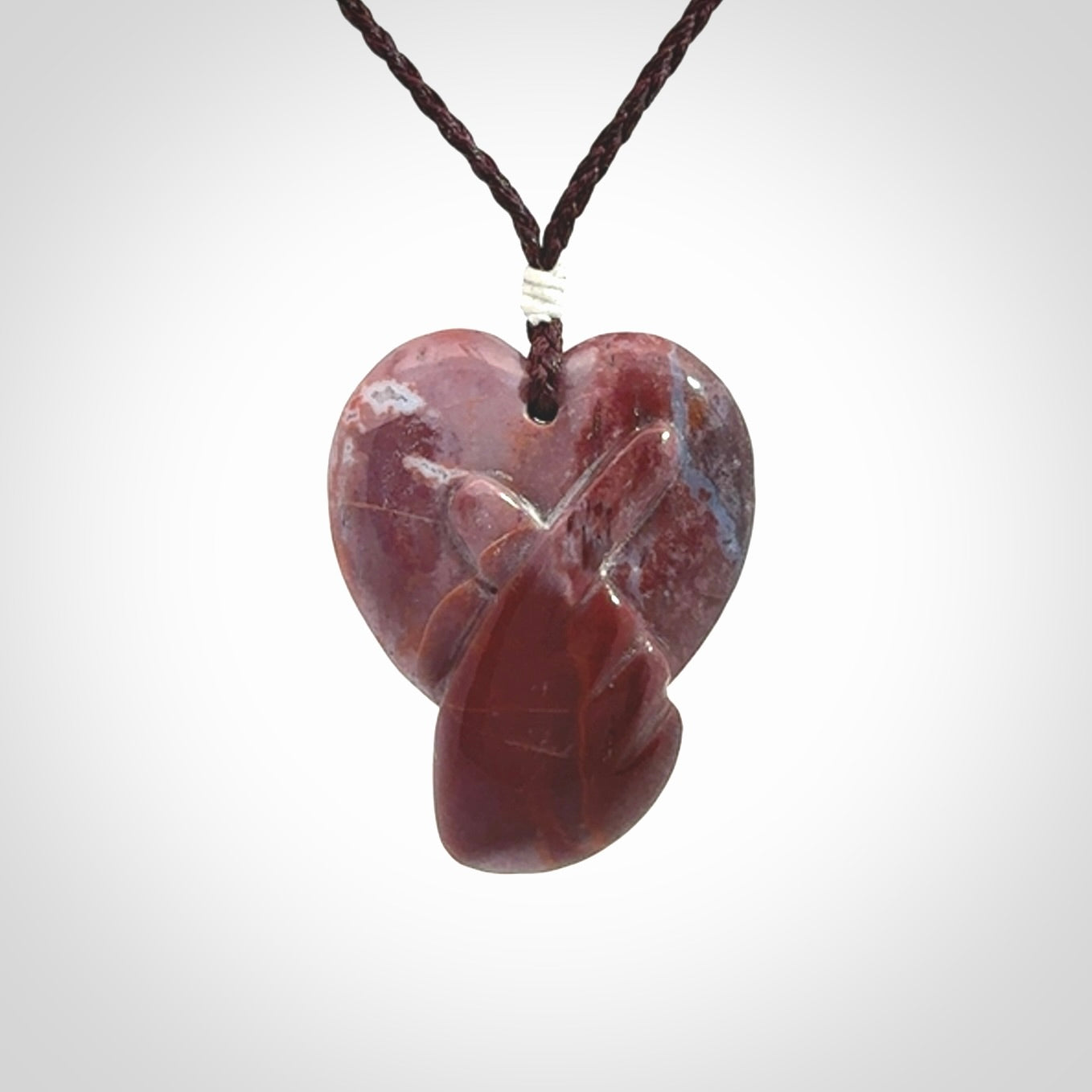 This is a hand carved love heart pendant made from a gorgeous and striking piece of Brecciated jasper stone. This is a superbly carved and very unique piece. For sale online from NZ Pacific.