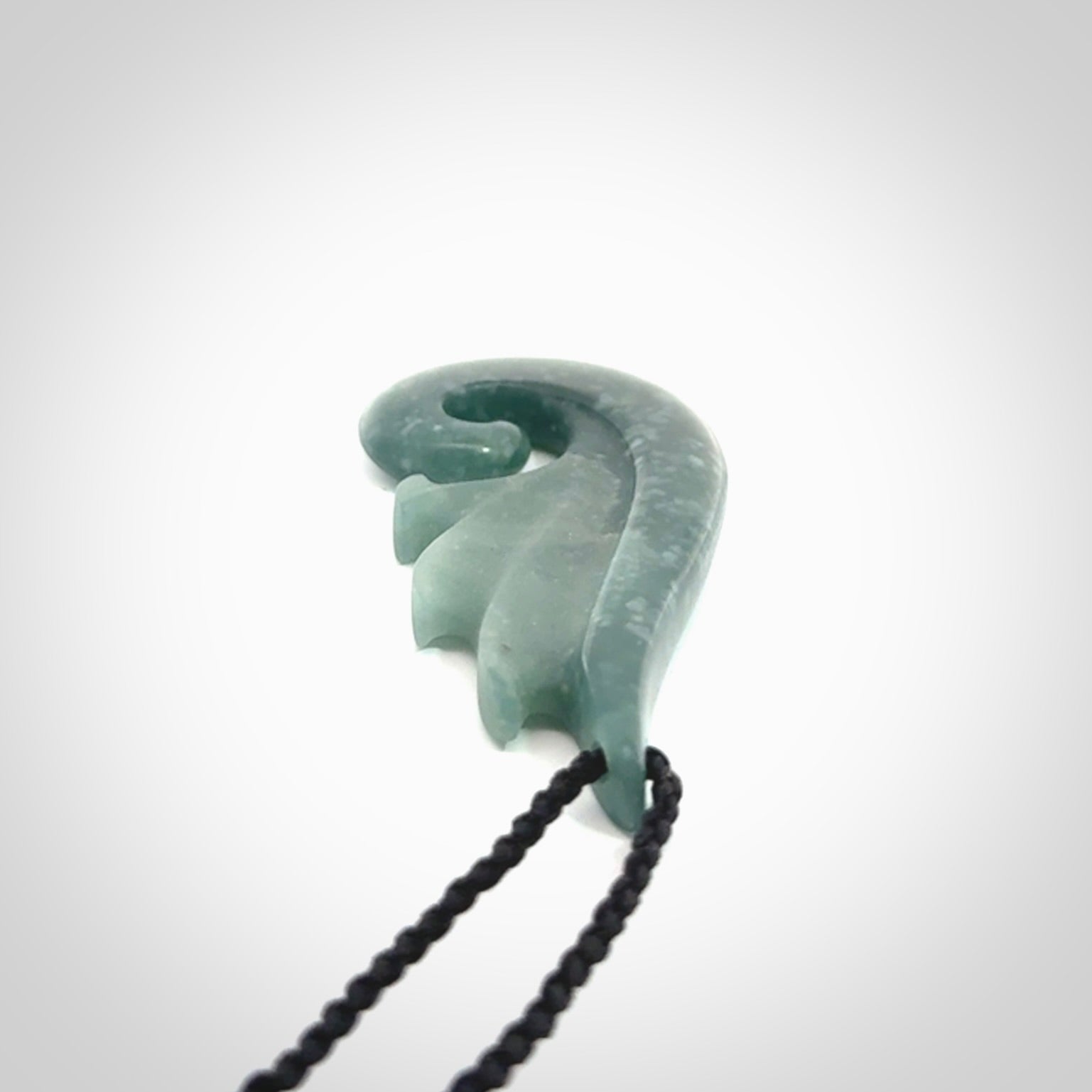 Hand carved large Guatemalan Jade shell koru drop pendant.