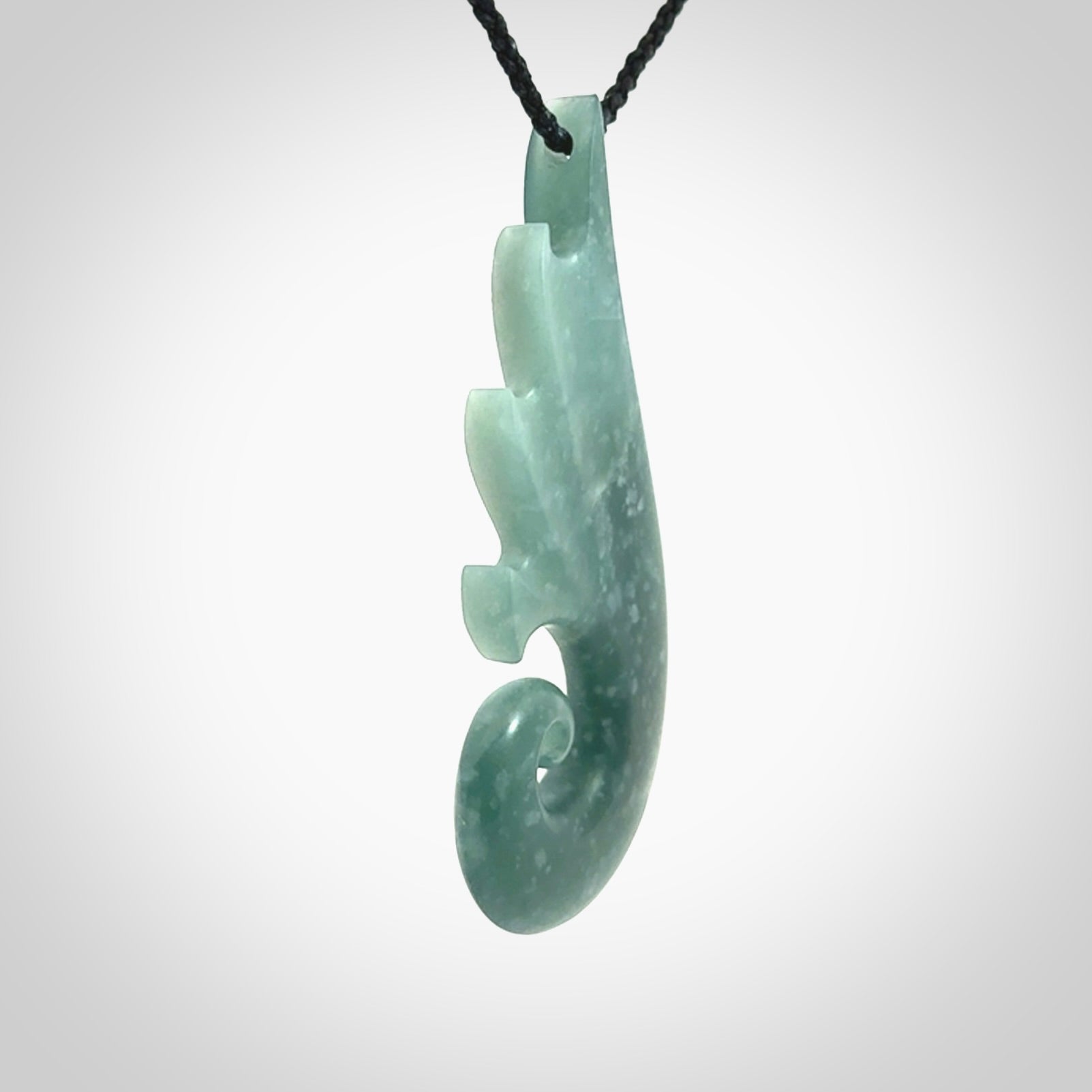 Hand carved large Guatemalan Jade shell koru drop pendant.