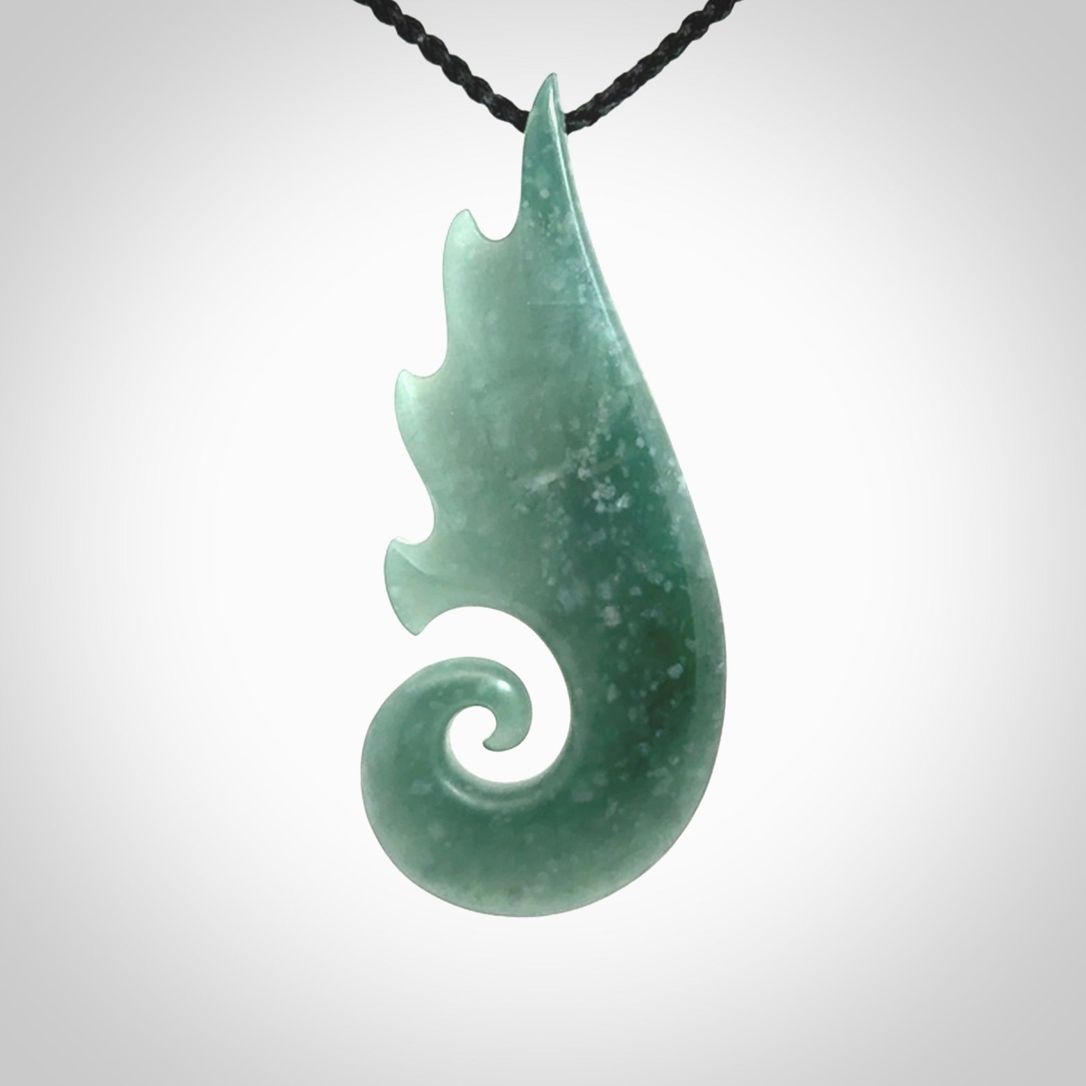 Hand carved large Guatemalan Jade shell koru drop pendant.