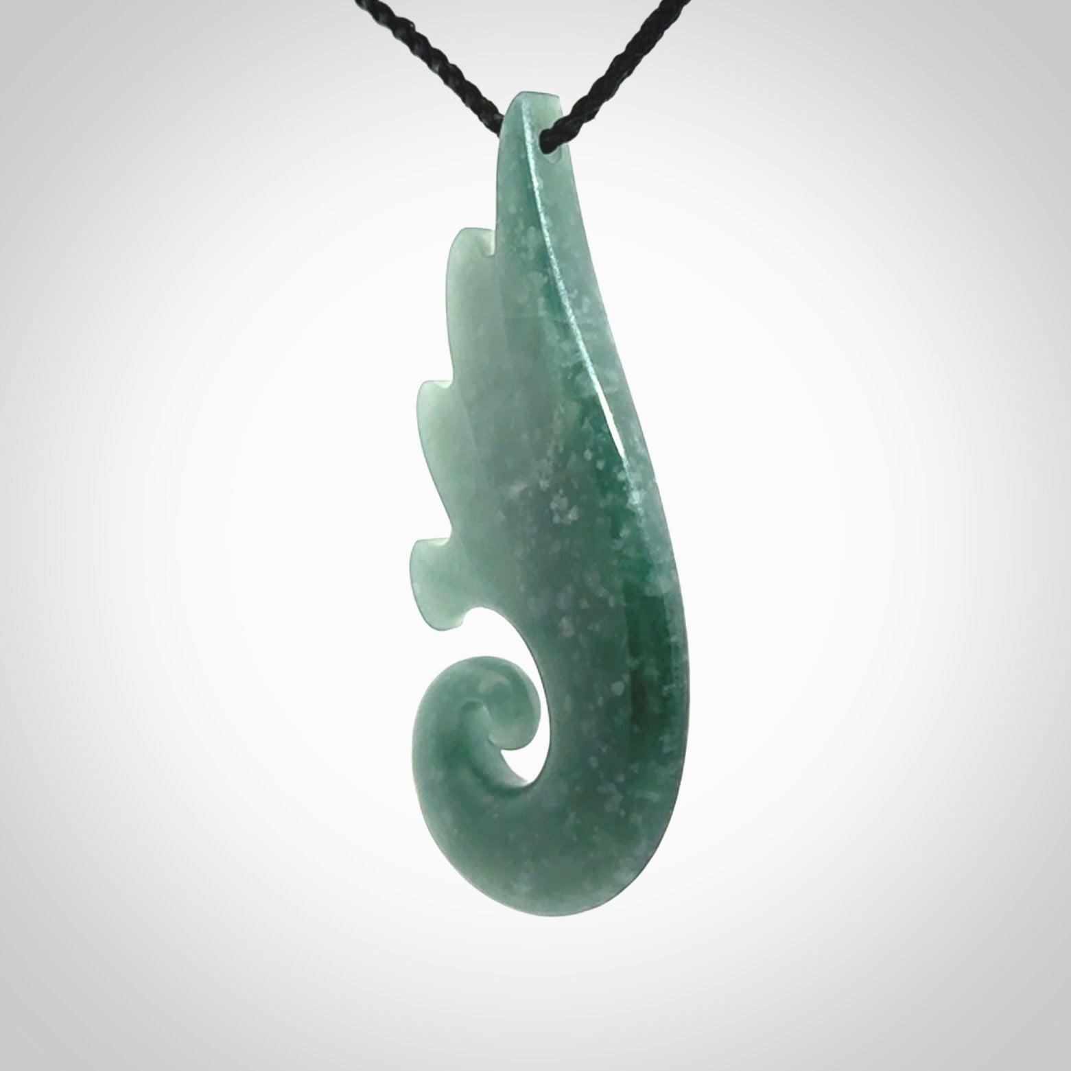 Hand carved large Guatemalan Jade shell koru drop pendant.