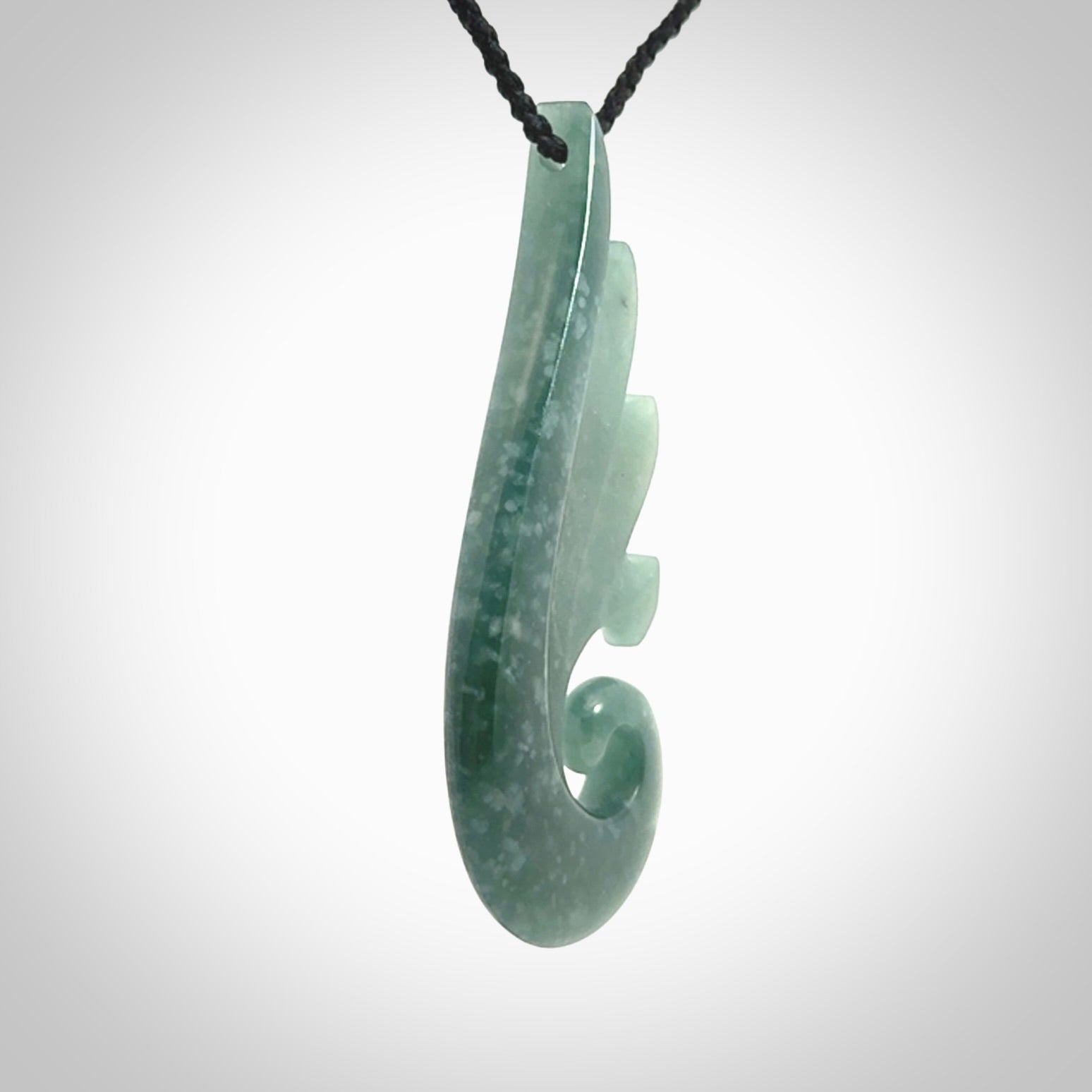 Hand carved large Guatemalan Jade shell koru drop pendant.