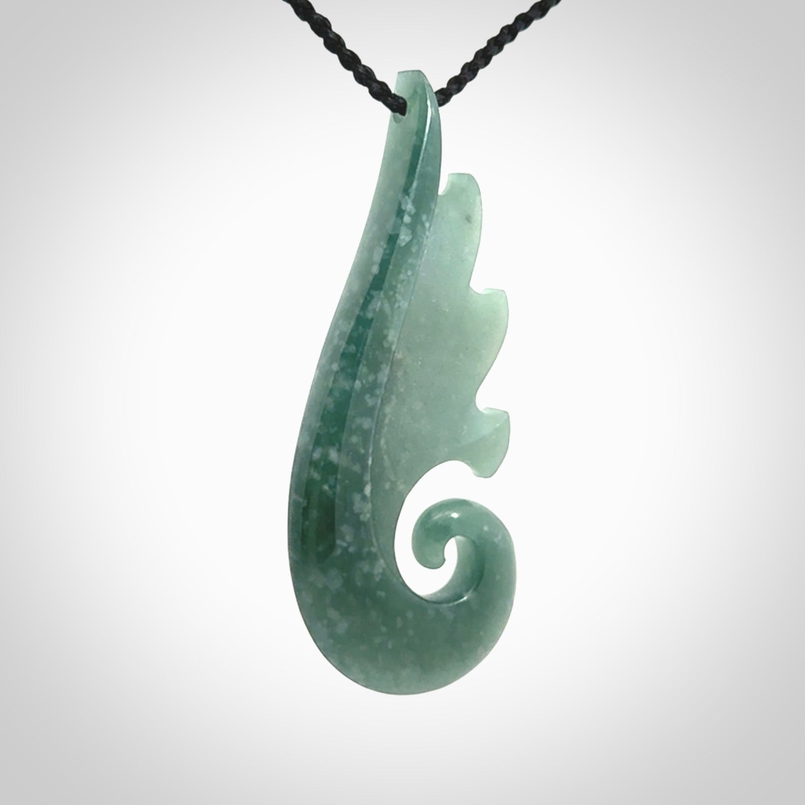 Hand carved large Guatemalan Jade shell koru drop pendant.