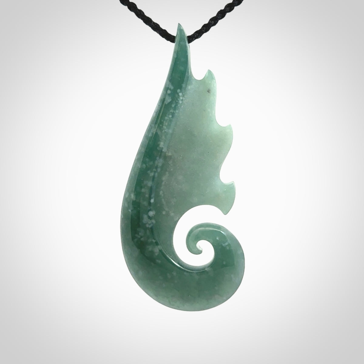 Hand carved large Guatemalan Jade shell koru drop pendant.