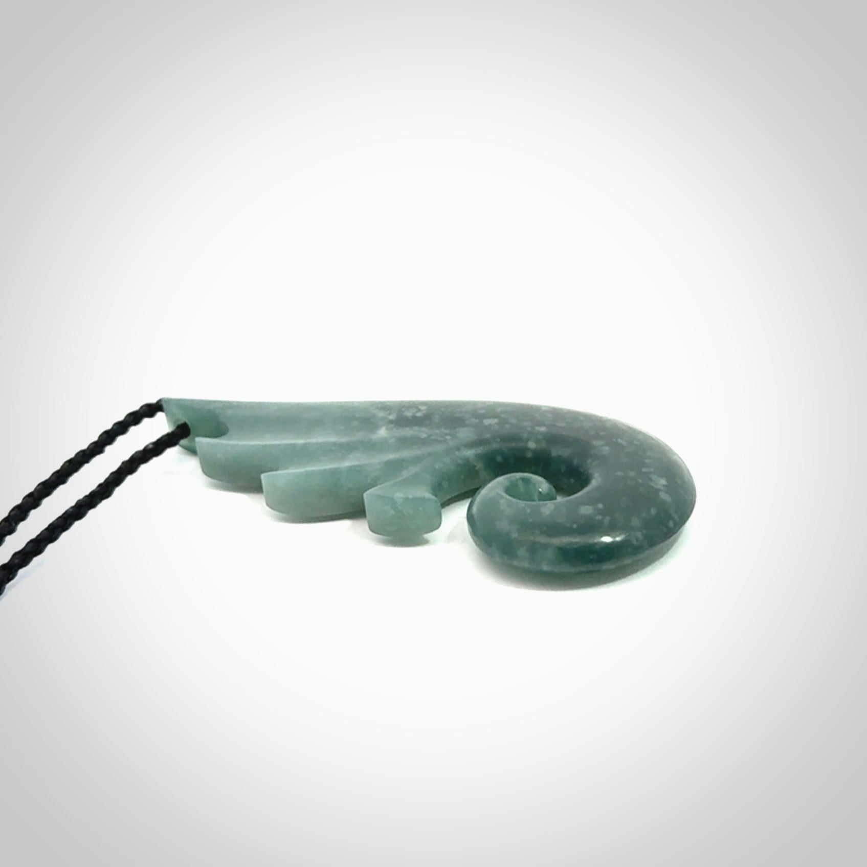 Hand carved large Guatemalan Jade shell koru drop pendant.