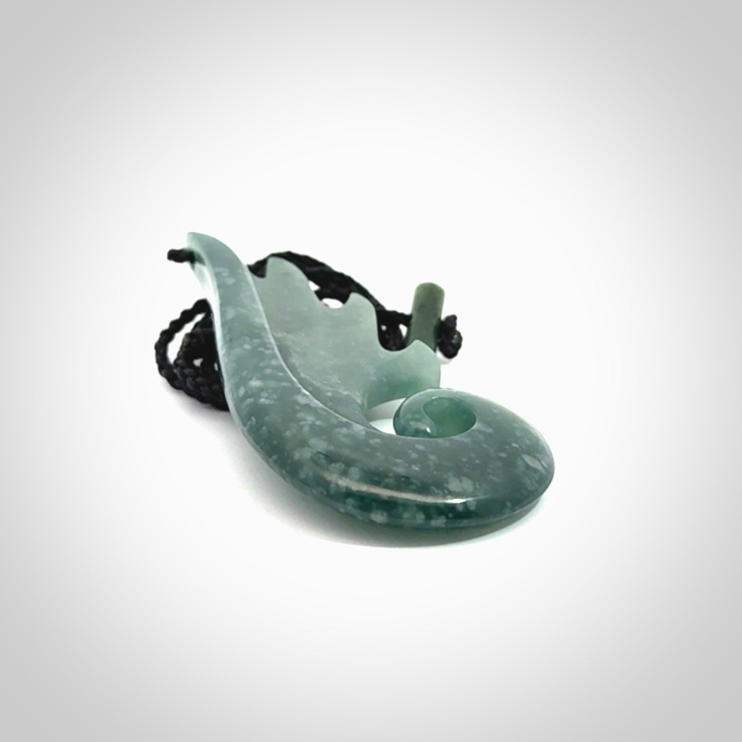 Hand carved large Guatemalan Jade shell koru drop pendant.