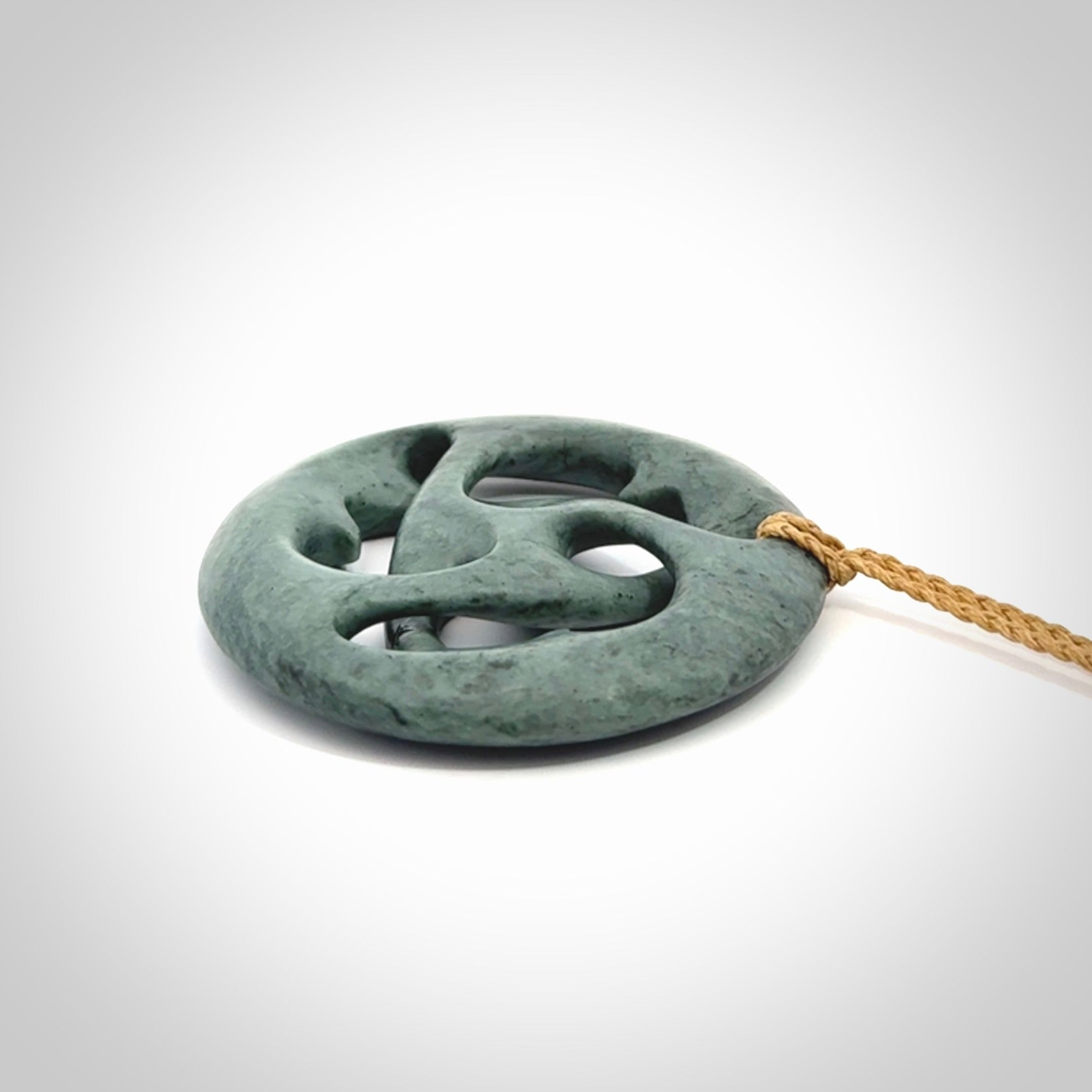 Hand carved New Zealand Nelson blue jade, complex twist drop pendant. Hand made complex twist pendant hand carved in New Zealand.