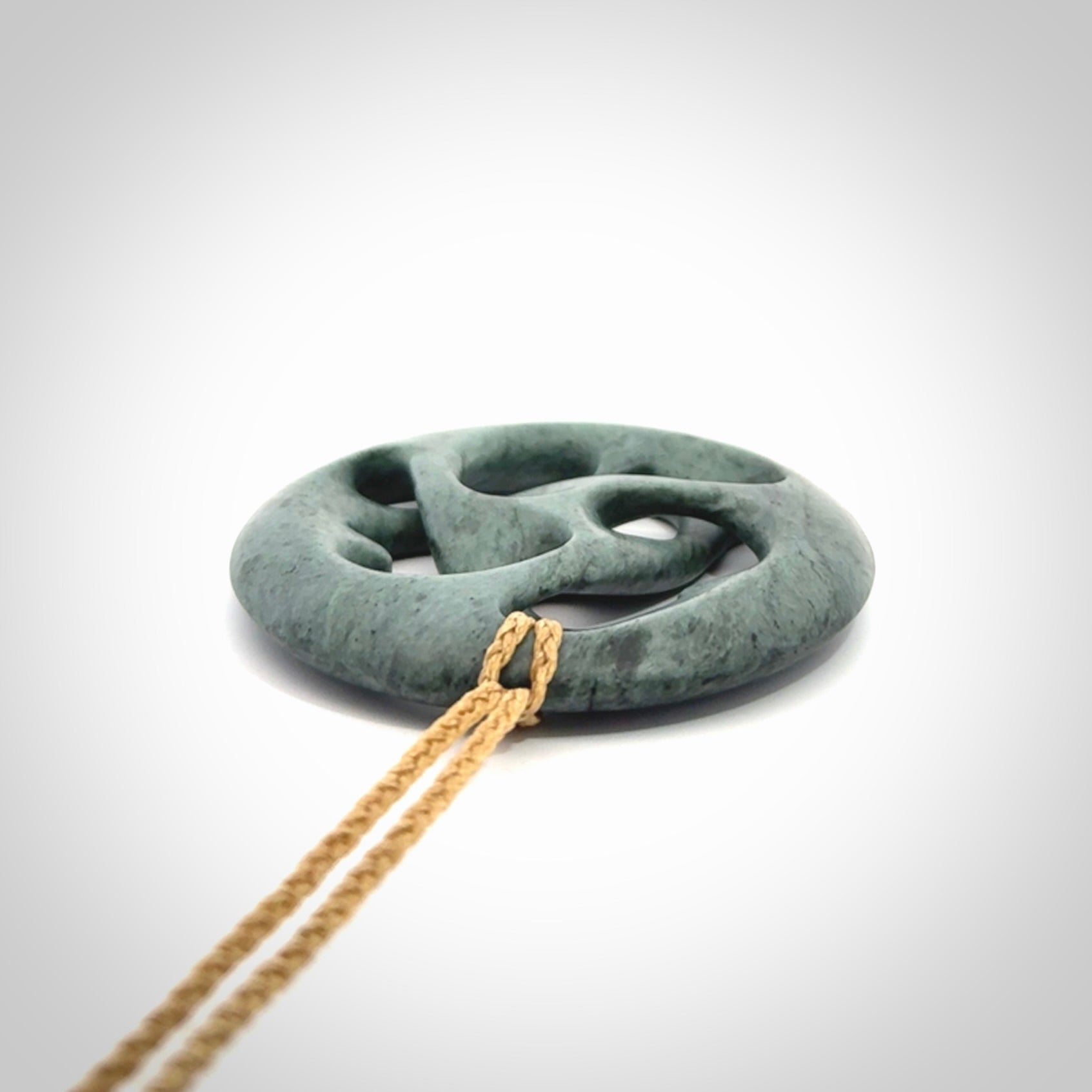 Hand carved New Zealand Nelson blue jade, complex twist drop pendant. Hand made complex twist pendant hand carved in New Zealand.