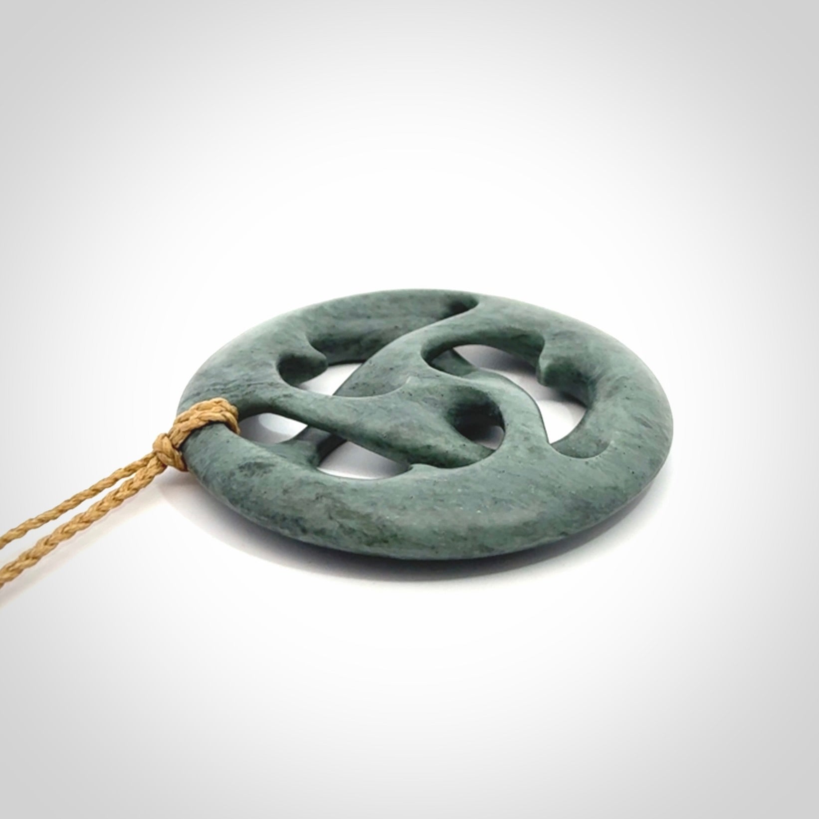 Hand carved New Zealand Nelson blue jade, complex twist drop pendant. Hand made complex twist pendant hand carved in New Zealand.