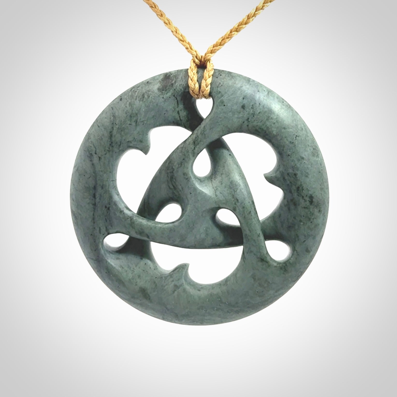 Hand carved New Zealand Nelson blue jade, complex twist drop pendant. Hand made complex twist pendant hand carved in New Zealand.