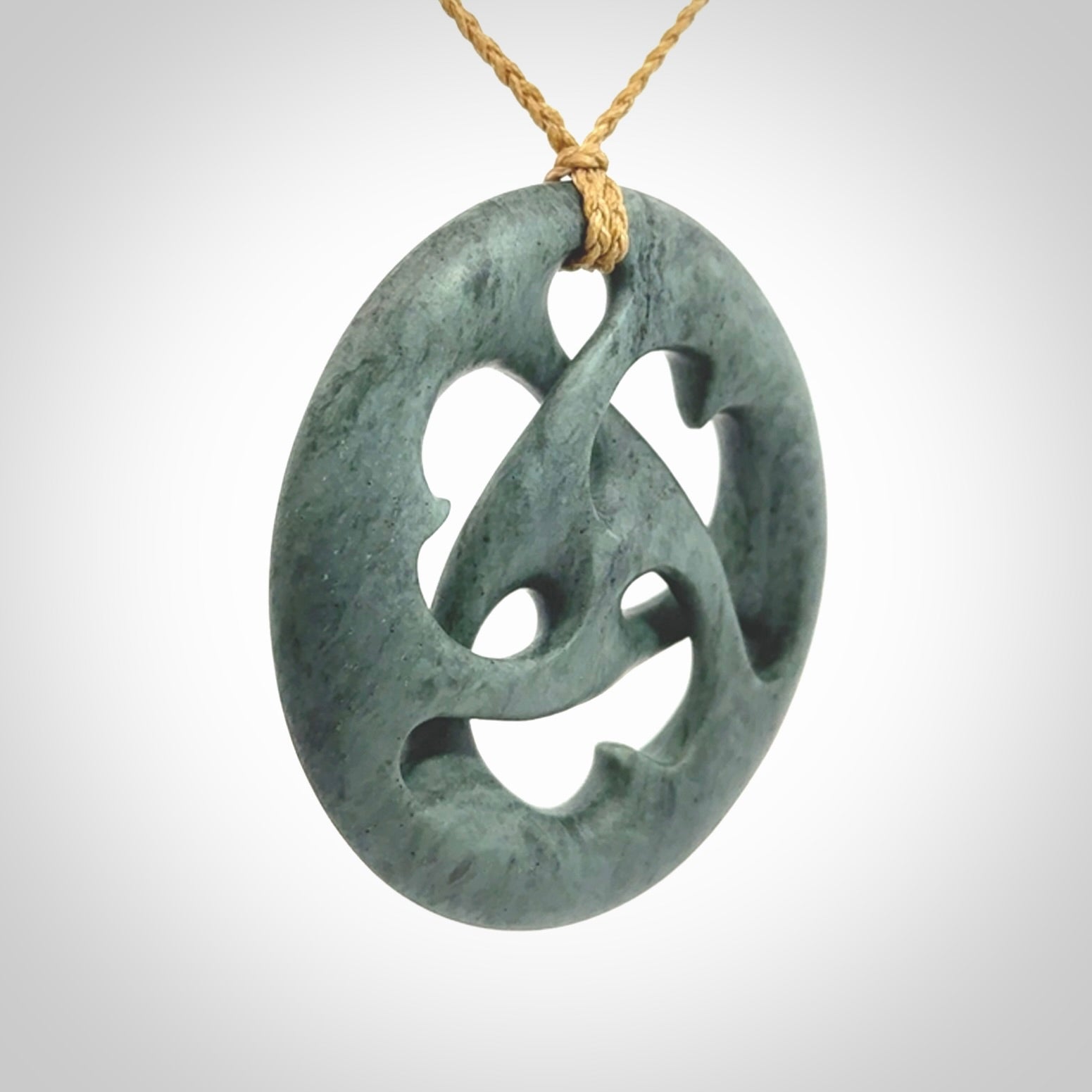 Hand carved New Zealand Nelson blue jade, complex twist drop pendant. Hand made complex twist pendant hand carved in New Zealand.