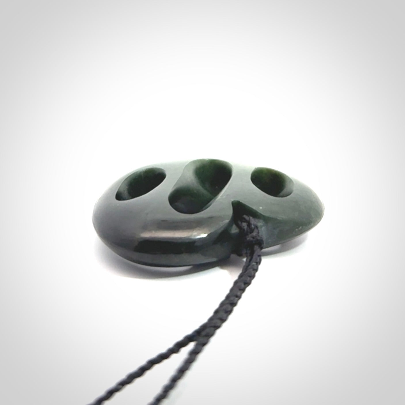 Hand carved New Zealand jade, complex twist heart pendant.