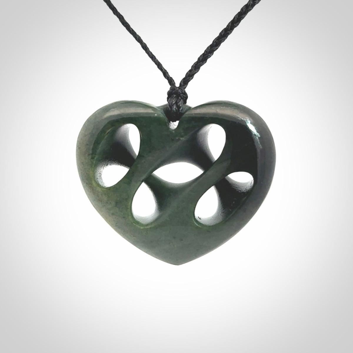 Hand carved New Zealand jade, complex twist heart pendant.