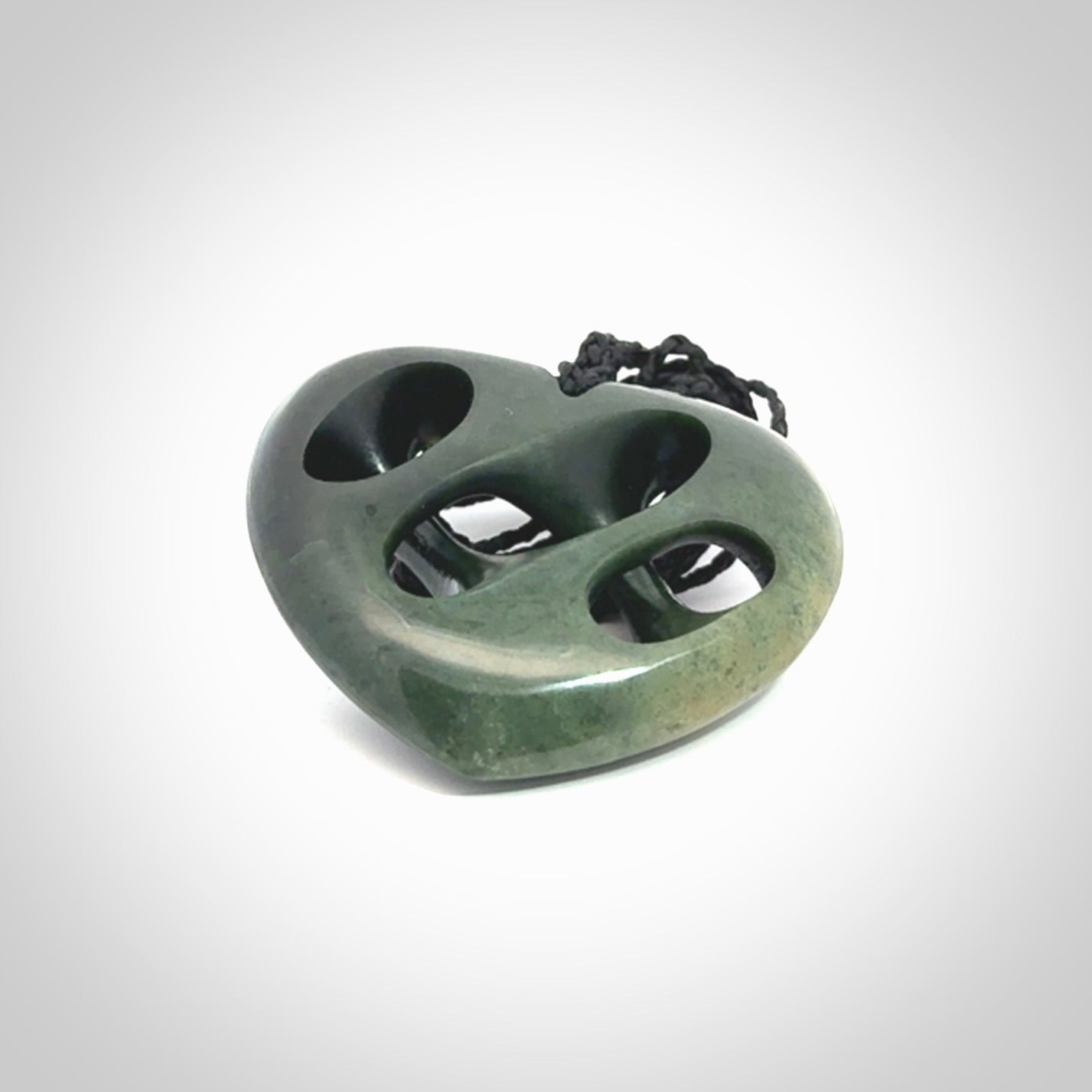 Hand carved New Zealand jade, complex twist heart pendant.