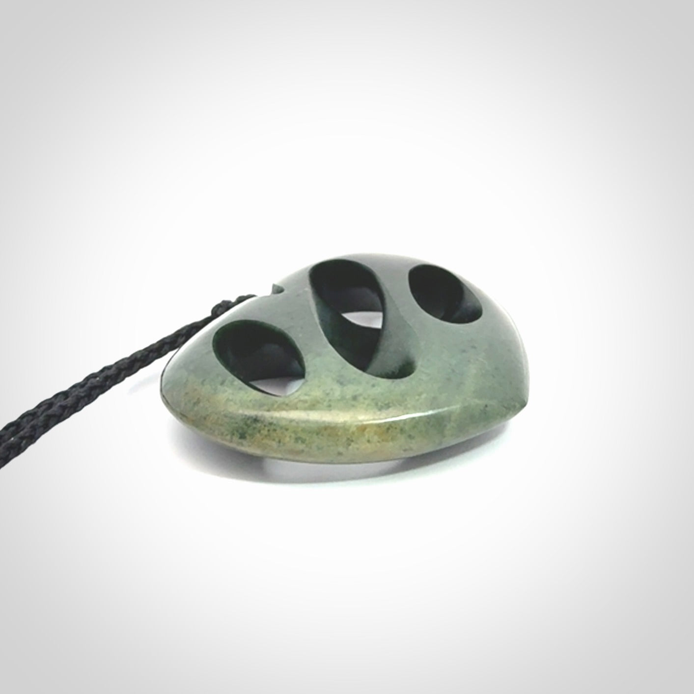 Hand carved New Zealand jade, complex twist heart pendant.