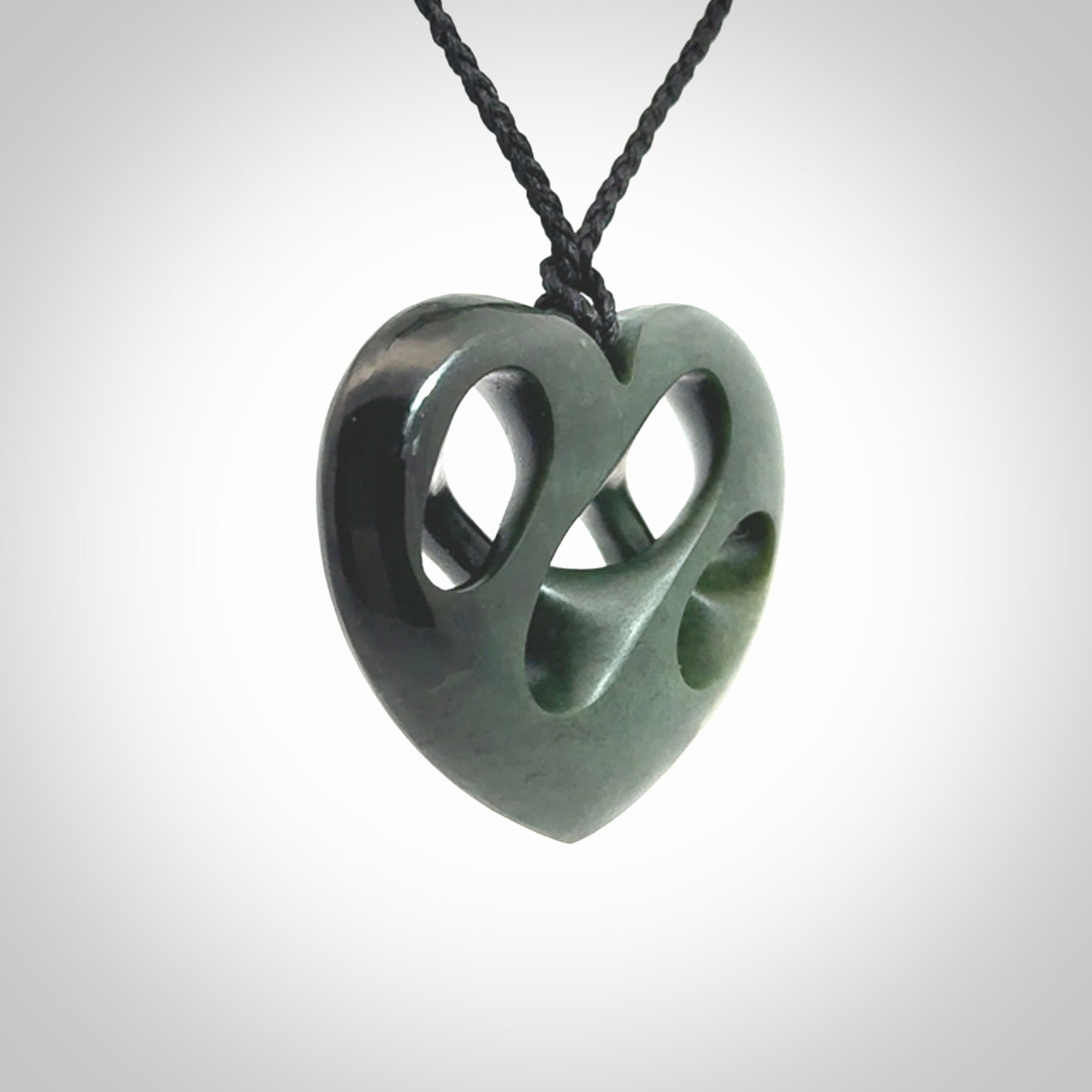 Hand carved New Zealand jade, complex twist heart pendant.