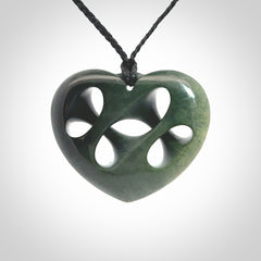 Hand carved New Zealand jade, complex twist heart pendant.